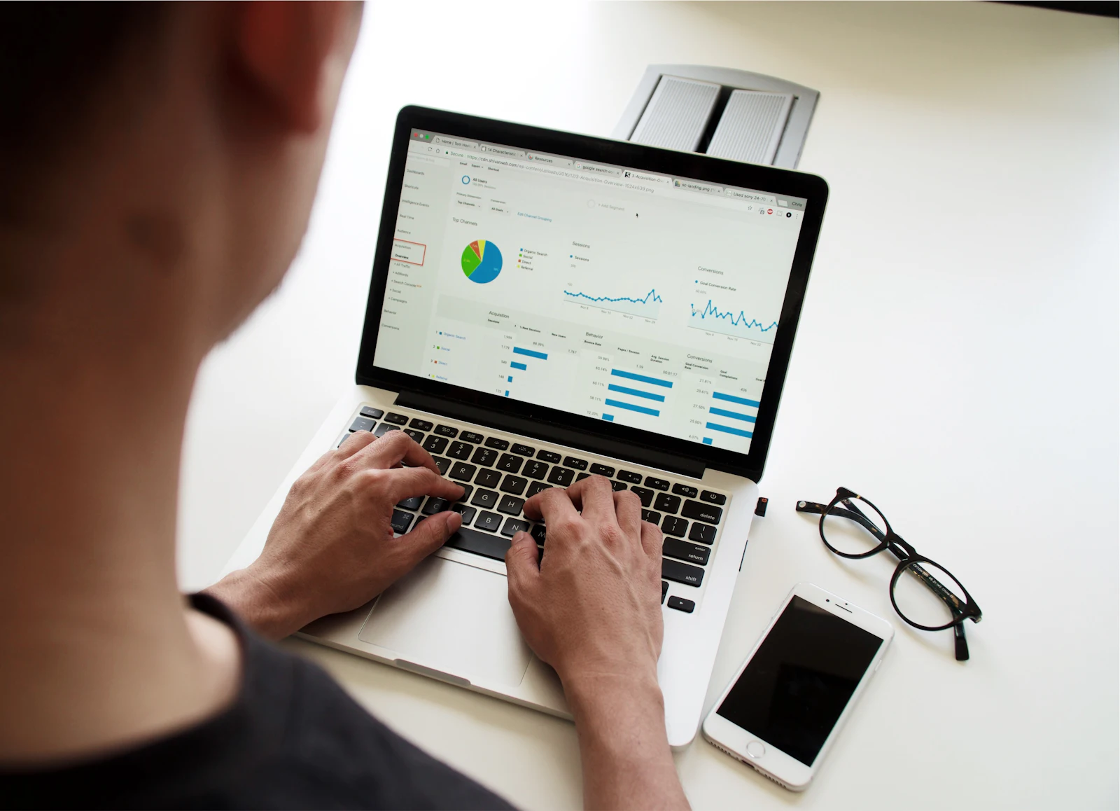 Analyst reviewing CRM performance reports