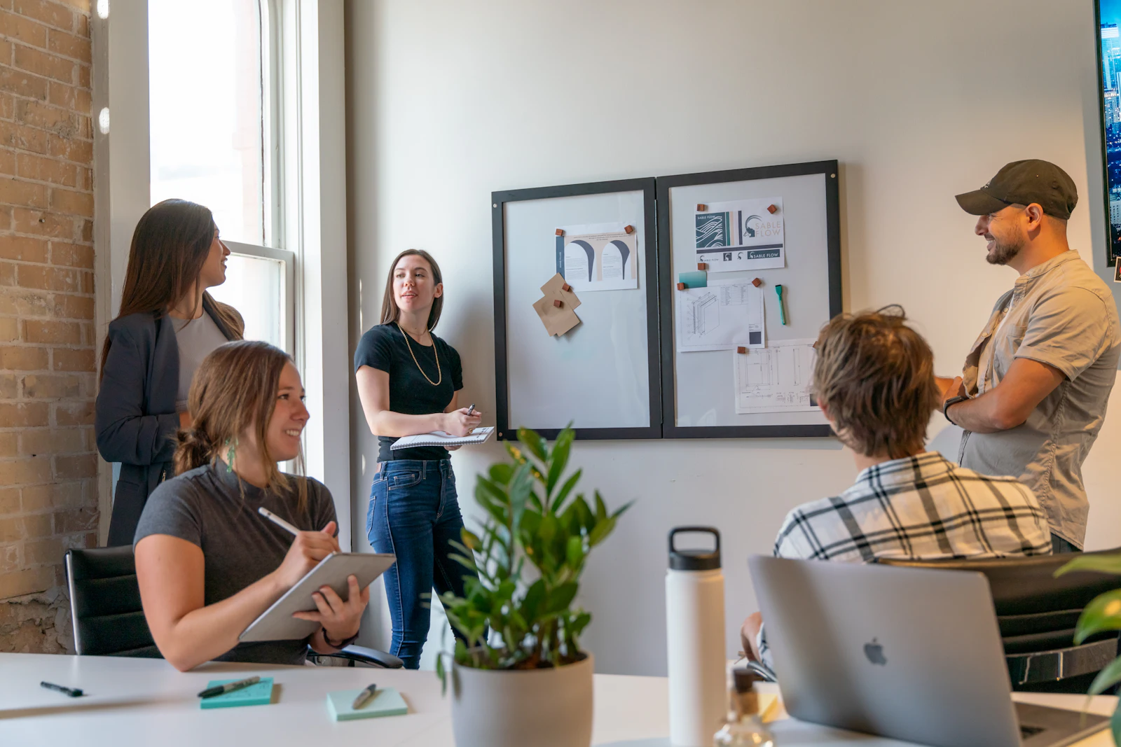 The TemplateIt team planning a template release at the whiteboard